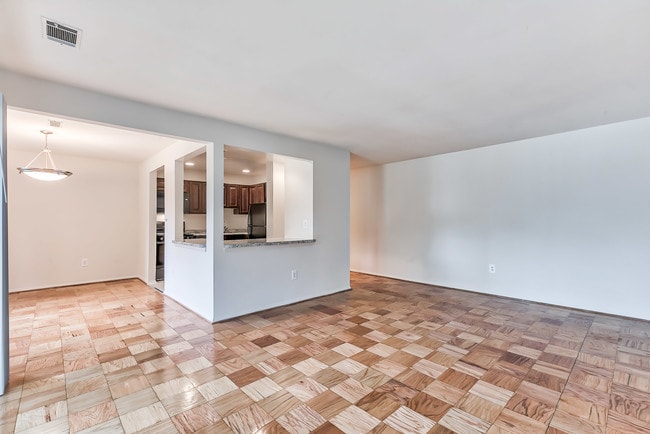 Living and dining room area with wood floor