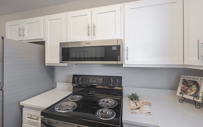 Stainless steel appliances paired with clean finishes for a sleek, modern look.