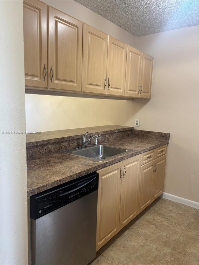 Building Photo - 8600 N Sherman Cir Unit 203