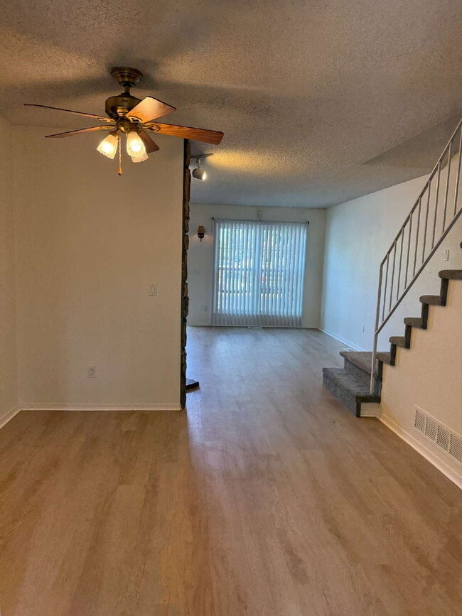 Photo - Cozy 2 Bed, 1.5 Bath Townhouse with Fireplace + Community Pool + Reserved Parking Space! Unit A
