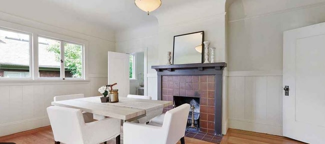 Dining room w/decorative fireplace - 2644 Benvenue Ave Unit Charming Elmwood Apt