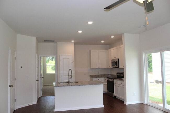 Photo - Sun-Filled 3-Story End-Unit Townhome with Fenced Yard, Storage & Resort-Style Pool