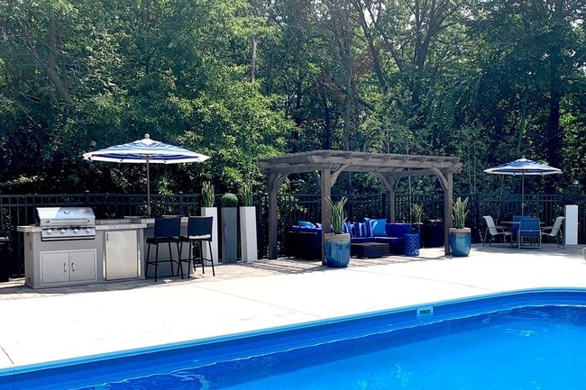 Utilize our gas grill and have a cookout by the pool. - Dunlap Falls Apartments