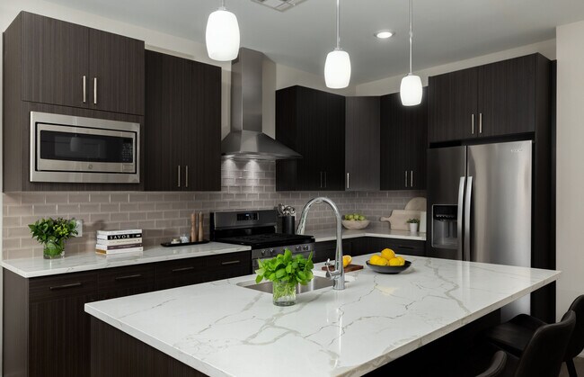 Experience culinary excellence in this sleek modern kitchen.