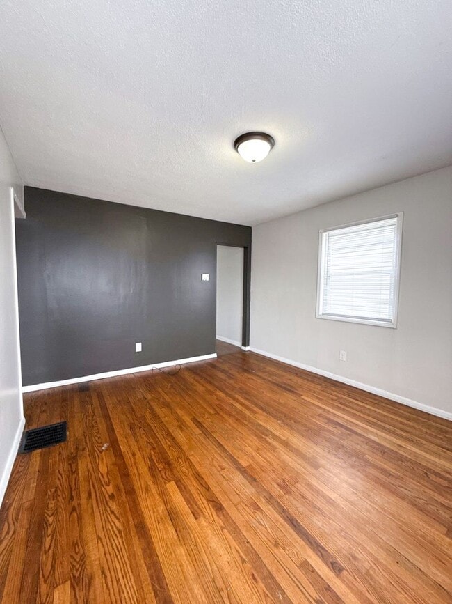 Photo - Move-In Ready 2BR Home w/ Refinished Hardwood Floors + Bonus Room Basement!