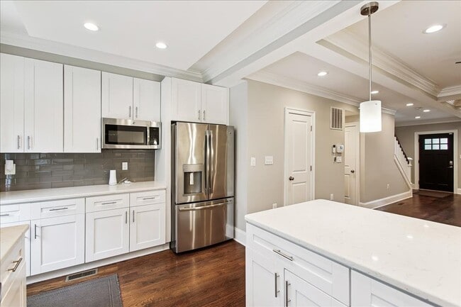 Photo - Modern 4BR Home w/ Fireplace, In-Law Suite + Parking in Prime DC Location!