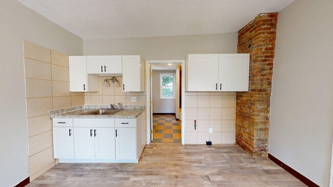 Building Photo - 7023 Clark Ave Unit UP