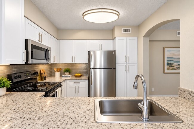 Elevate your lifestyle at Mosaic with this stunning kitchen designed for both functionality and style. Modern appliances, elegant finishes, and spacious countertops make it a perfect space for culinary creativity. Schedule your tour today!