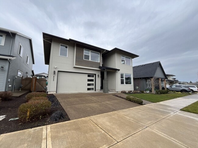 Photo - Modern 5 Bedroom Home in Reed’s Crossing Featuring Guest Suite, Open Floor Plan, and EV Charger