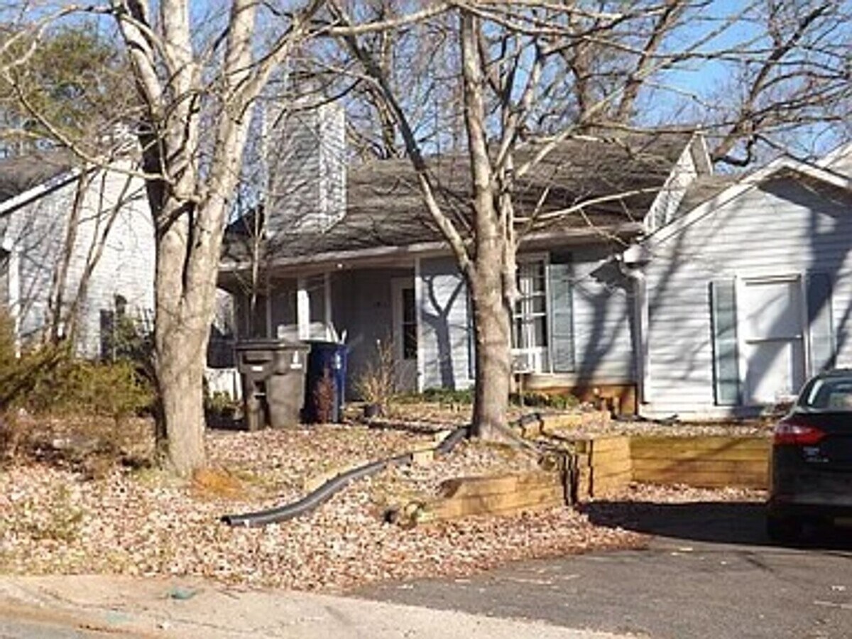 Photo - Charming 2BR/1BA home featuring a private driveway, small backyard, and a screened porch overlook...