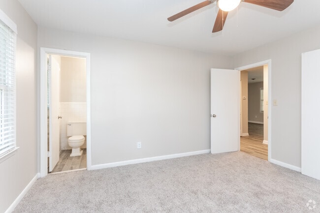 Carpeted Bedroom with Bathroom Attached
