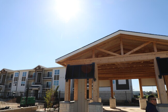 This stunning outdoor barbeque next to the pool will be great for hosting. - The Entrada at San Marcos