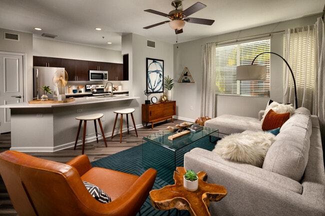 One Bedroom Apartments in La Mesa CA - The District - Spacious Living Room and Kitchen with Wood-Style Flooring