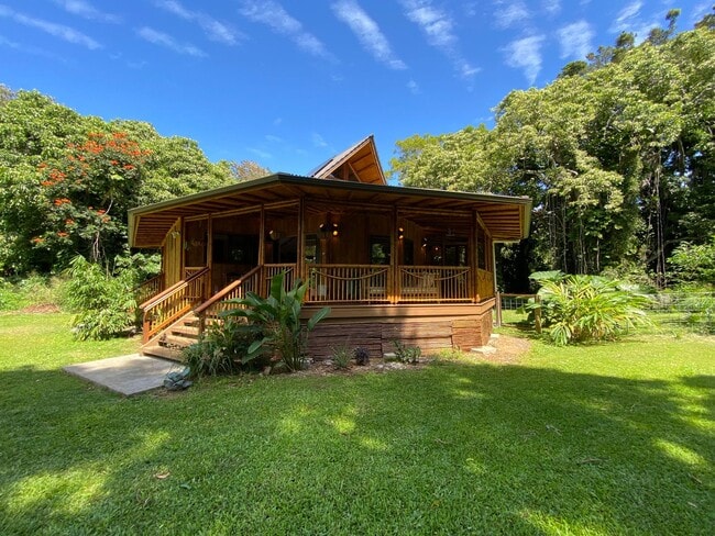 Building Photo - For Rent: Custom Bamboo Home with Lush Garden Setting