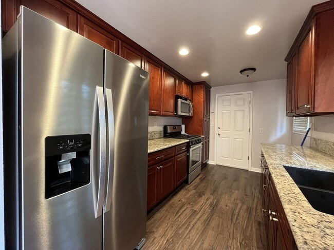 Photo - Charming Single-Level 3 Bedroom Home with Spacious Fenced Backyard, Landscaping Included & Great ...