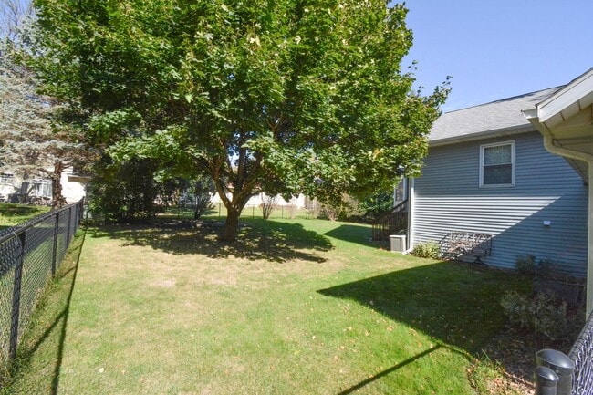 Photo - 3-Bedroom NE Rochester home with Sunroom, Fenced Backyard & Attached Garage