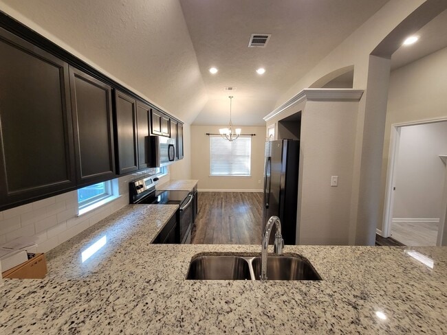 Photo - Bryan - 3 bedroom / 2 bath / 2 car garage house with fenced in back yard.