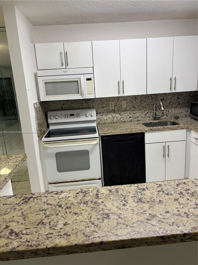 Photo - 911 NE 199th St Unit 104-14