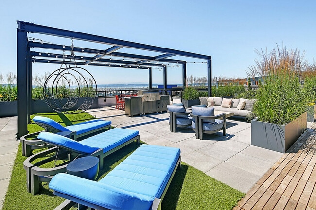 Experience the ultimate in outdoor comfort with this luxurious rooftop patio.