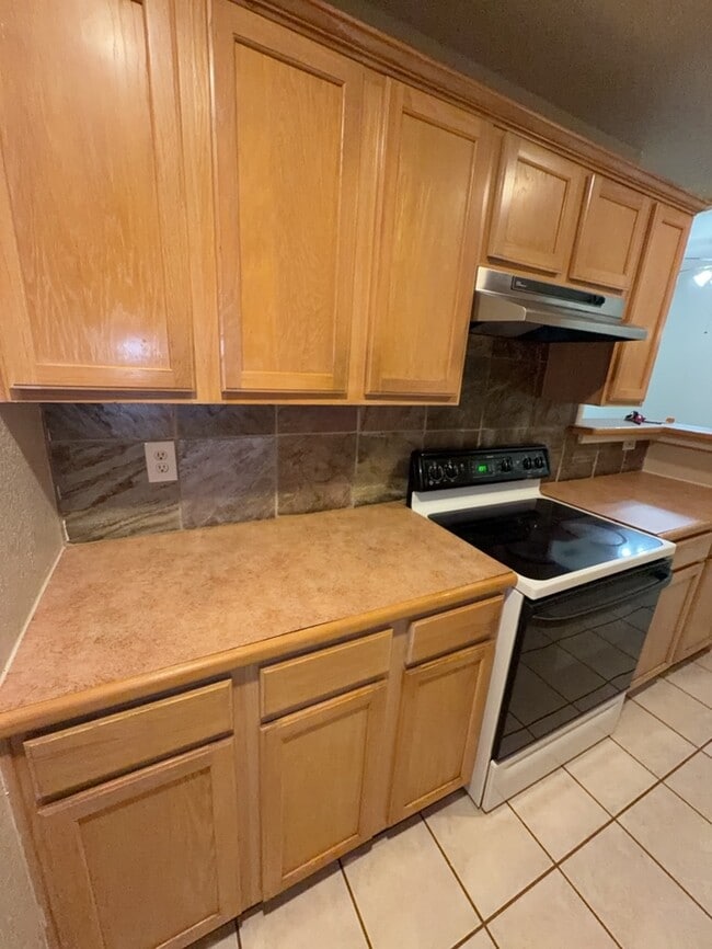3/2/2 features an open and inviting living and dining area, updated wood-look flooring, and a spa...
