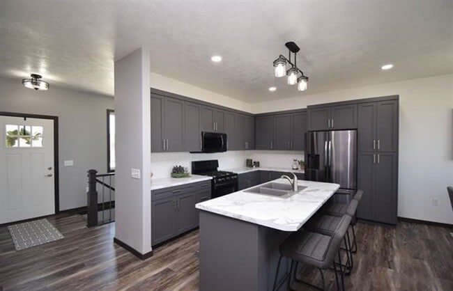 Photo - Spacious 4-Bedroom Ranch Home with Finished Basement & Oversized Garage!