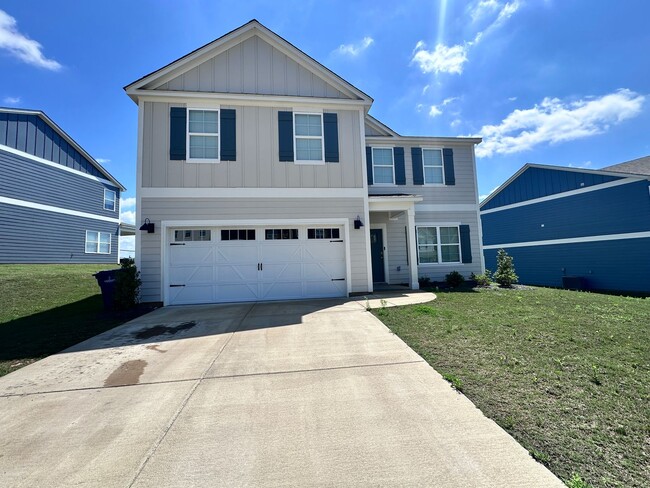 Building Photo - efficient two-level home provides a large living room, 4 very spacious bedrooms, and 2.5 bathrooms