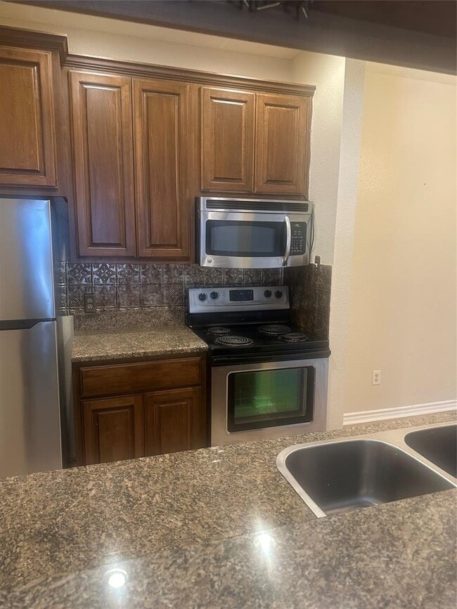 Building Photo - 12166 Metric Blvd Unit 1007