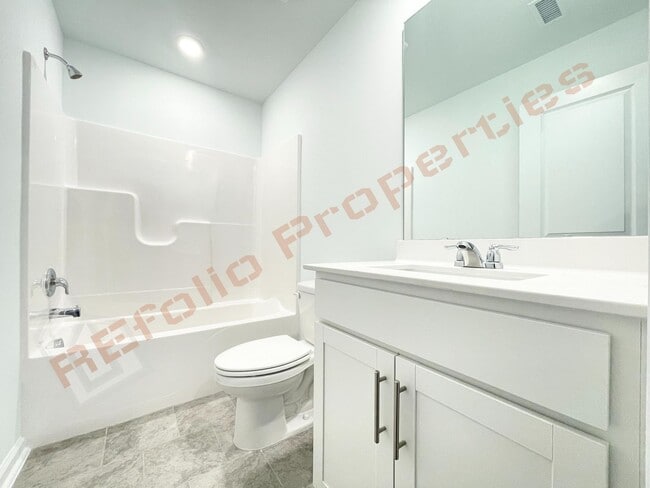 Photo - Brand New 3 Story, 4 bedroom, 3.5 bathroom Townhome Featuring a 1st floor Guest Suite, 2 Car Gara...