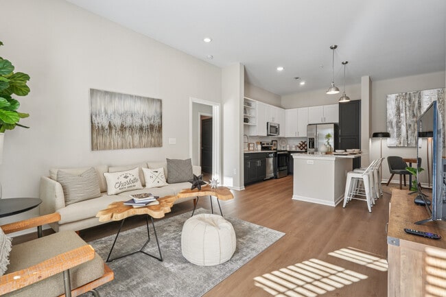 Kitchen and living room with hard surface flooring - Avalon at Palisades