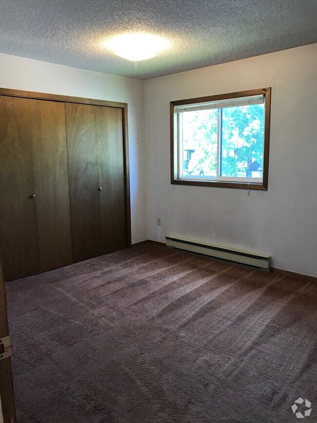 Building Photo - Charming 2-Bedroom Condo Near MSU – Pet Fr...