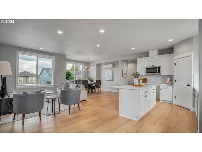 Photo - Spacious and Light-Filled Newly Built Condo Offering an Open Layout, Island Kitchen, and Outdoor ...