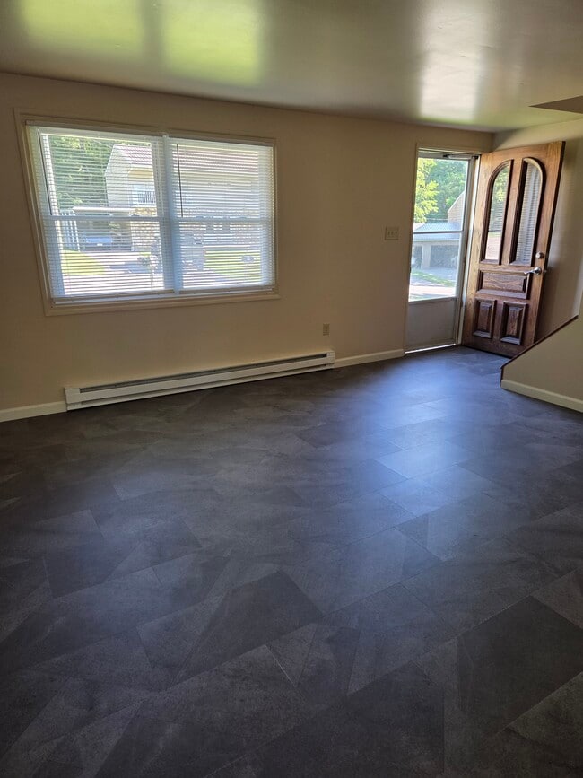New gray slate laminate flooring in living room. - 102 Stonecrest