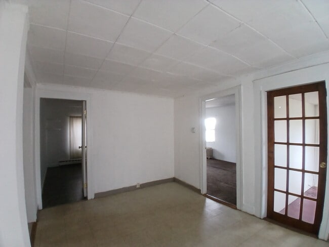 Living room looking into front bedroom and middle bedroom - 252 Clark St Unit 1