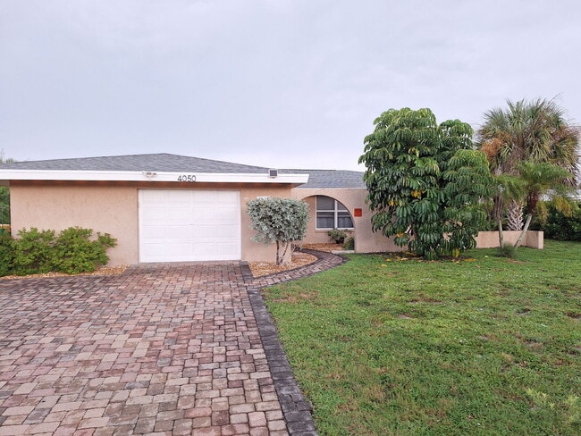 Building Photo - Gulf Access Home on Canal Available Now