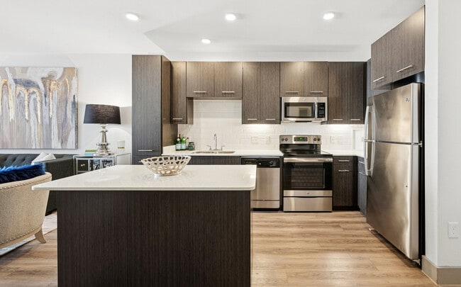 Stainless steel appliances and tiled kitchens