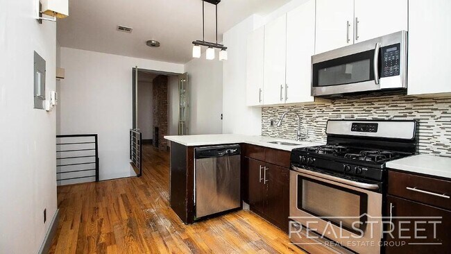 Photo - Gut-Renovated 3BR + Massive Finished Basement | Backyard, Laundry & HVAC | Bushwick Unidad 1L