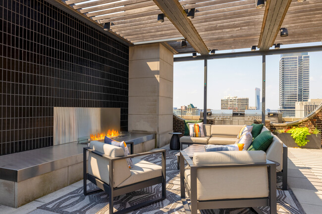 Sky Deck Seating with Fireplace - ICON Apartments