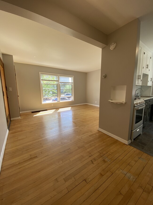 Main living area into kitchen - 812 W 35th St Apartments Unit 1