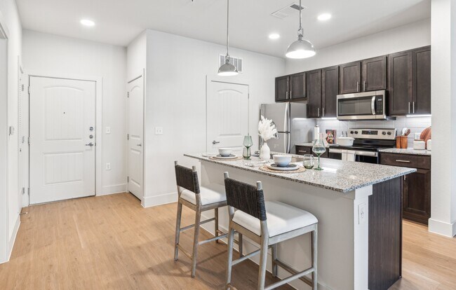 Your Kitchen: Hardwood floors, stainless steel appliances - Rushcreek at Star Ranch
