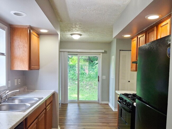 Photo - 4 Bed / 2 Full Bath House on a Quiet Dead-End Street — Attached Garage, Central A/C, W/D Hookups ...