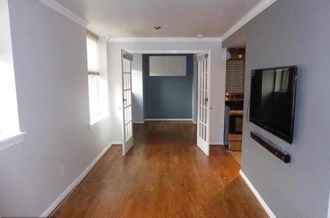 Living Room with LCD TV and surround sound. - 1436 Meridian Pl NW Apartment Unit 404