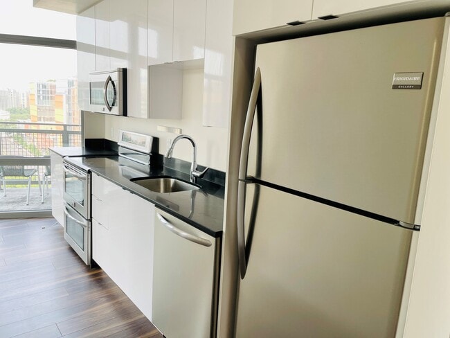 High gloss cabinets and stainless steel applicances