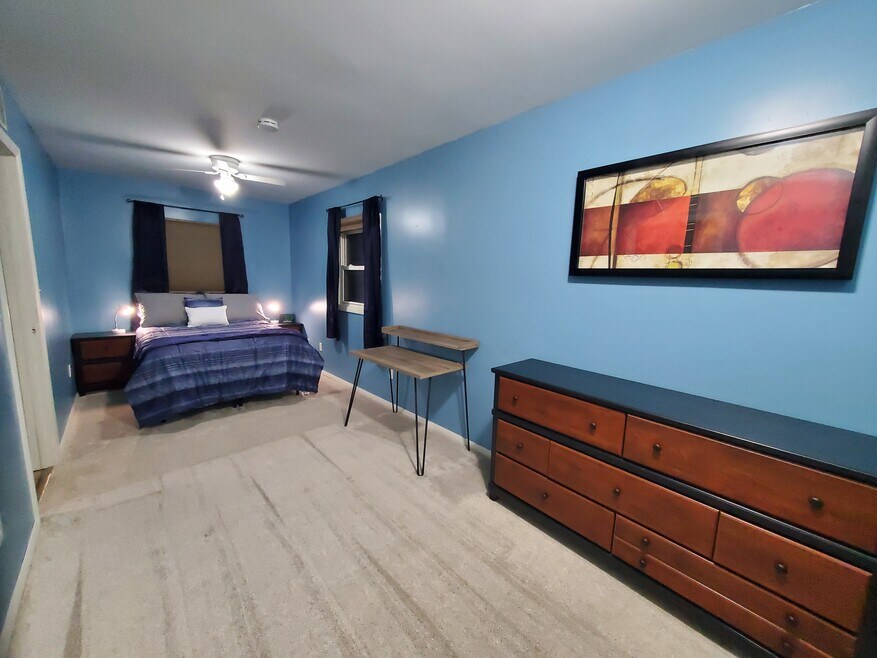 Large room with desk & dresser