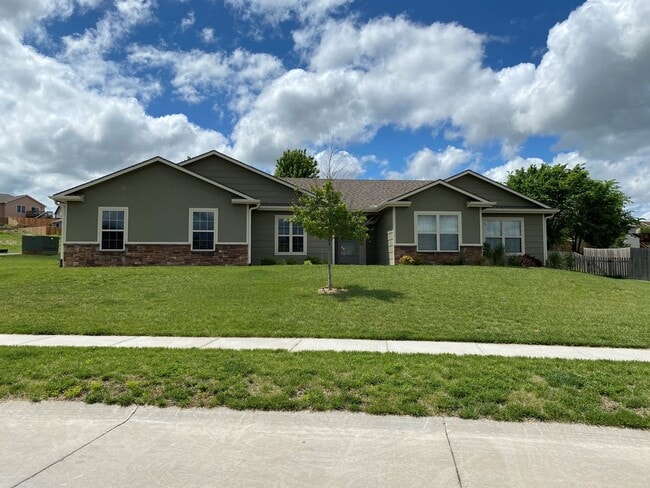 Building Photo - FENCED BACKYARD! BONUS ROOM/OFFICE! SAFE ROOM! THREE CAR GARAGE