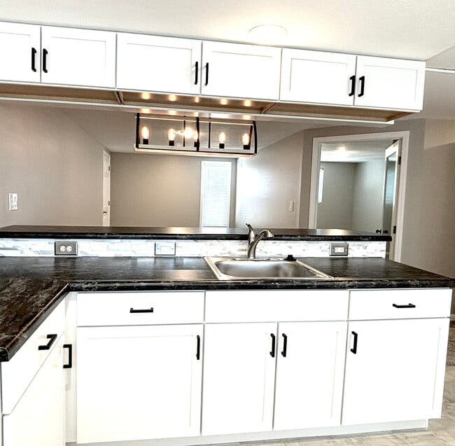 Kitchen view into living room - 9841 Cleveland Ave NW Unidad B