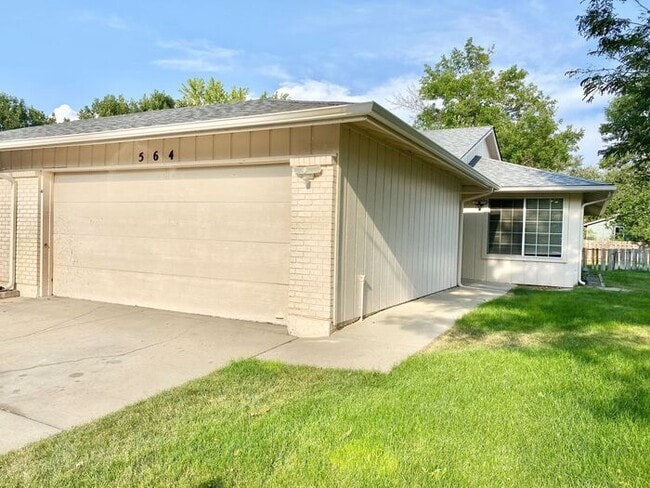 Photo - Spacious 3 Bedroom 1 Bath Duplex in South Loveland with Huge Fenced Backyard & 2-Car Garage!