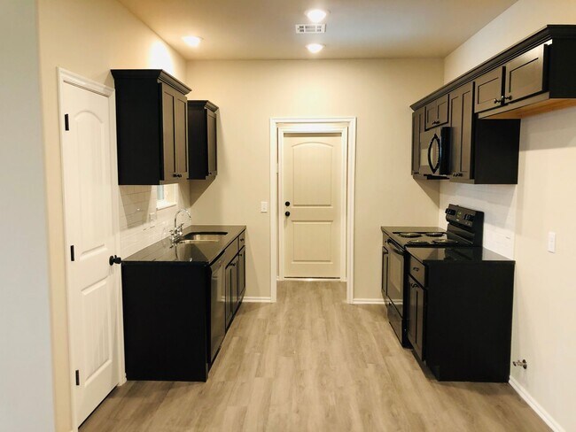 Photo - 3 BED 2 BATH 2 car garage DUPLEX great location, granite, luxury vinyl plank and fenced back yards!