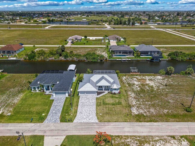 Photo - NOW AVAILABLE - Gorgeous Pool Home ~ NW Cape ~ 3 Car Garage ~ On Canal!