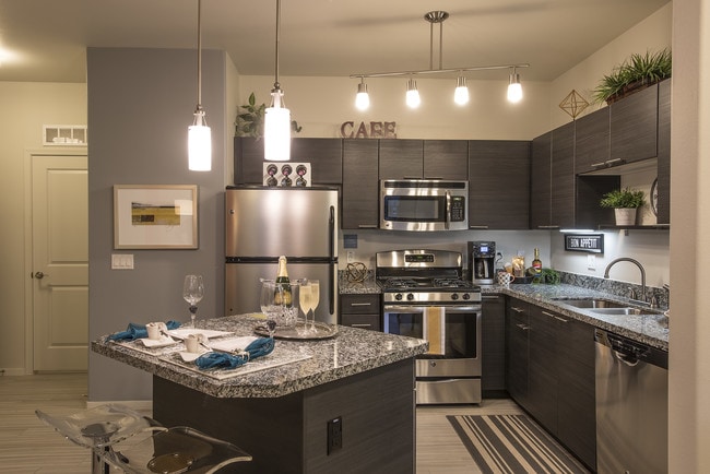 Kitchens feature sleek stainless steel appliance package and USB ports.
