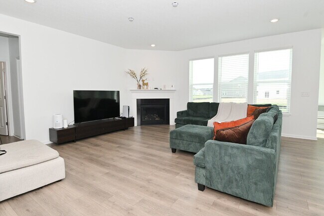 Photo - "Spacious 5-Bedroom Retreat with Luxurious Quartz Countertops & Fireplace on Deerberg Drive!"
